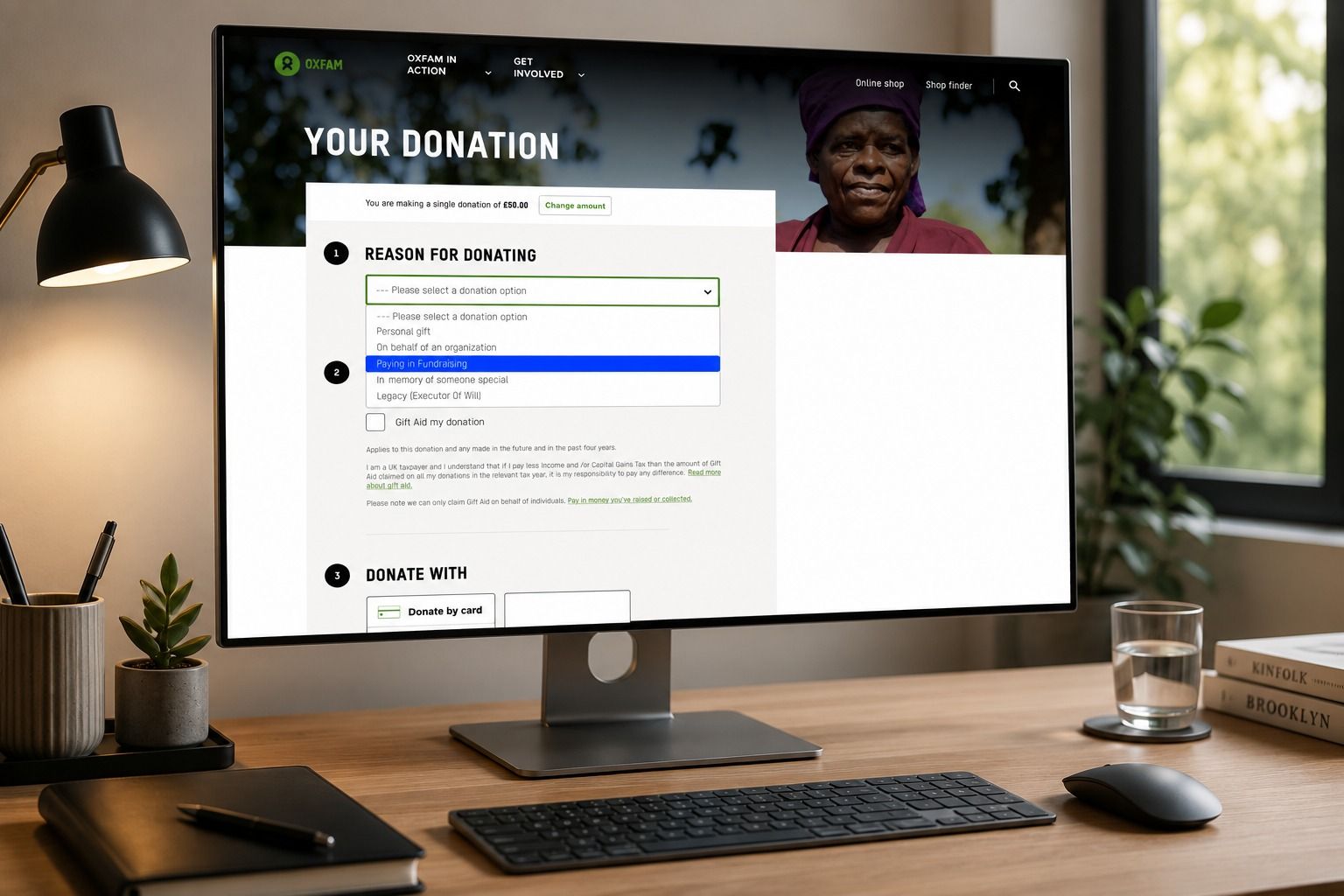 Oxfam GB's donation form, showing the reason-for-donating step and payment options